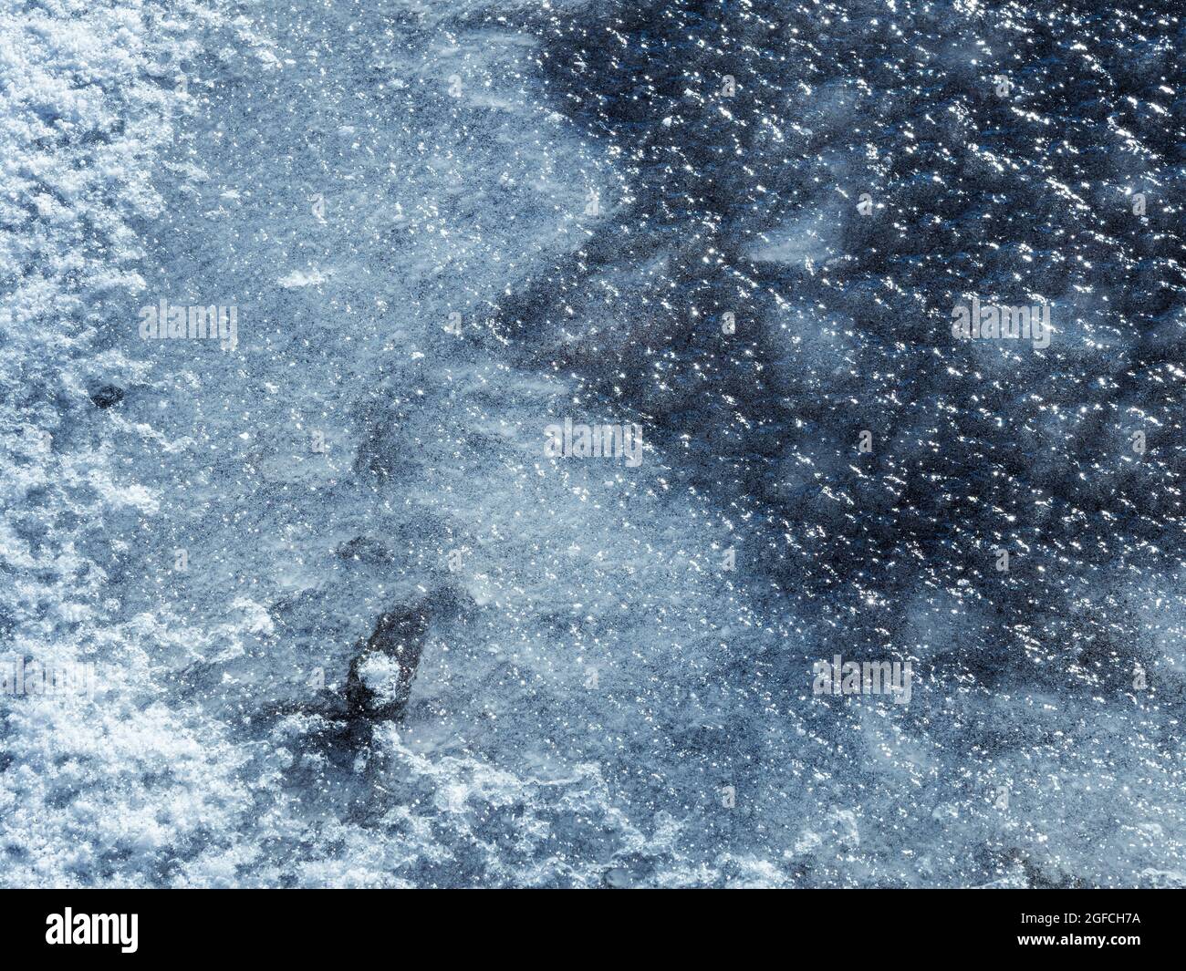 frozen water surface of river, close up view. frozen body of water, abstract winter season background Stock Photo
