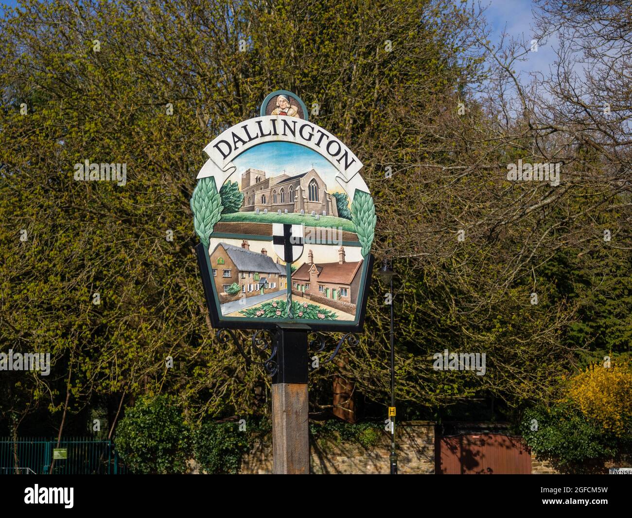 Colourful metal sign depicting local scenes on the village green, Dallington, Northampton, UK Stock Photo