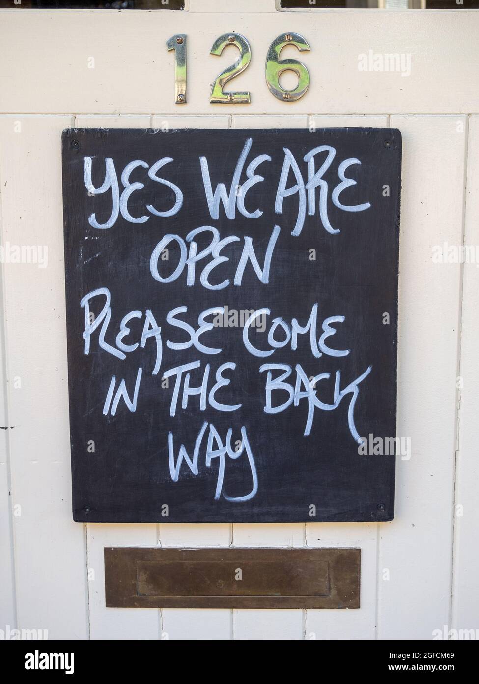 Signage on the front of a pub showing the easing of Covid restrictions, Dallington, Northampton, UK Stock Photo