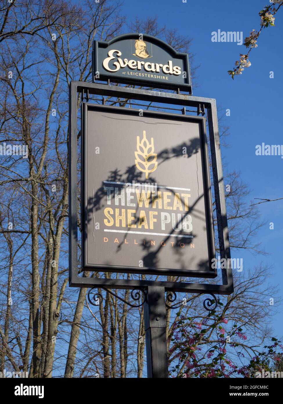 Pub sign for the Wheatsheaf, an Everard's pub in the village of Dallington, Northampton, UK Stock Photo
