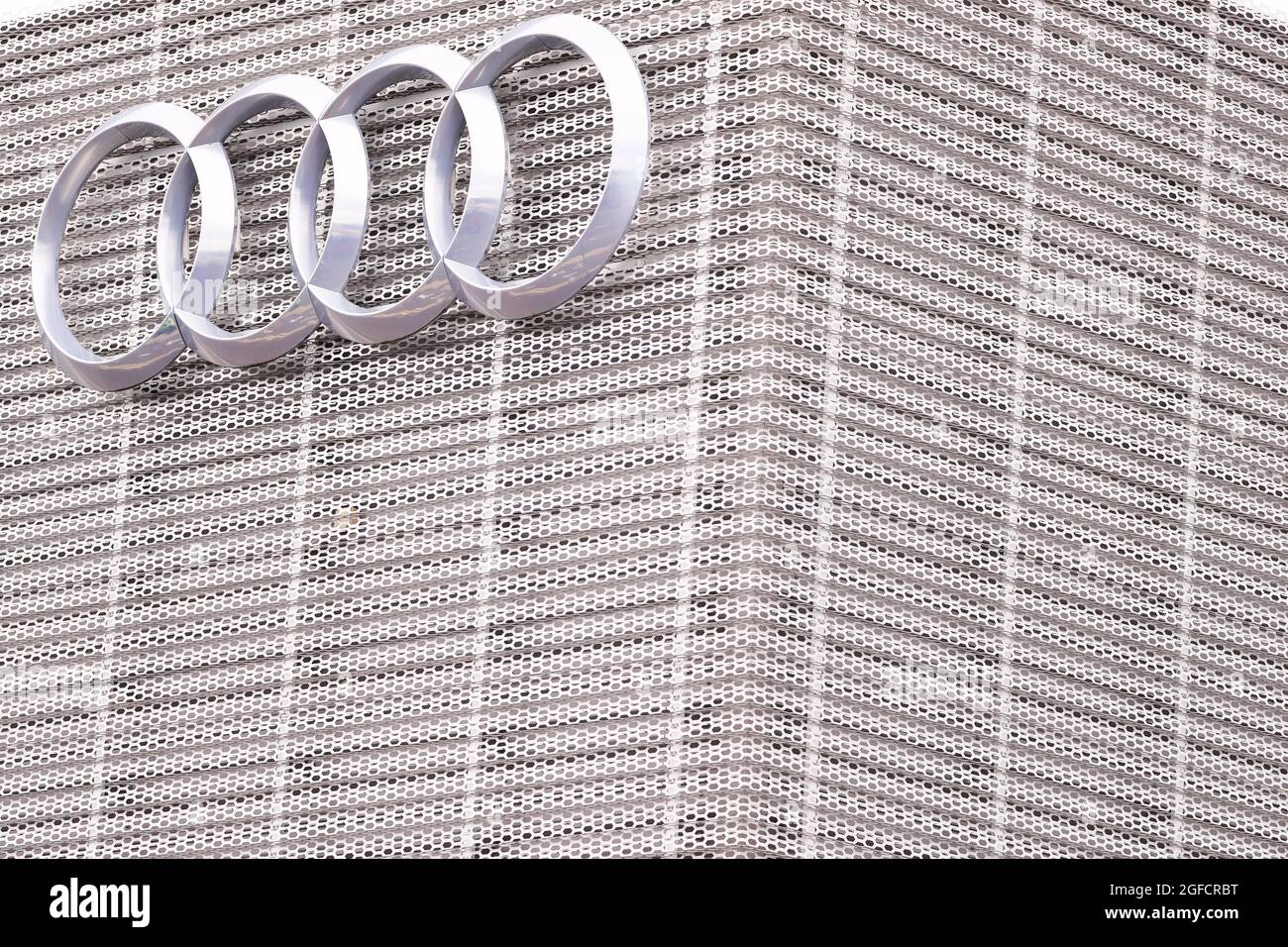 The Audi logo and signage at the main Audi car dealership in Belfast, Northern Ireland. Stock Photo