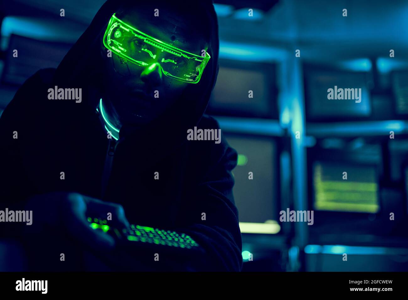 Cyber hacker breaks into databases to obtain information using a computer. Cybercrime and data security concept. Stock Photo