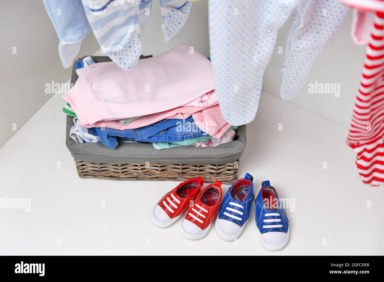 Basket of clothes for kids in wardrobe Stock Photo Alamy