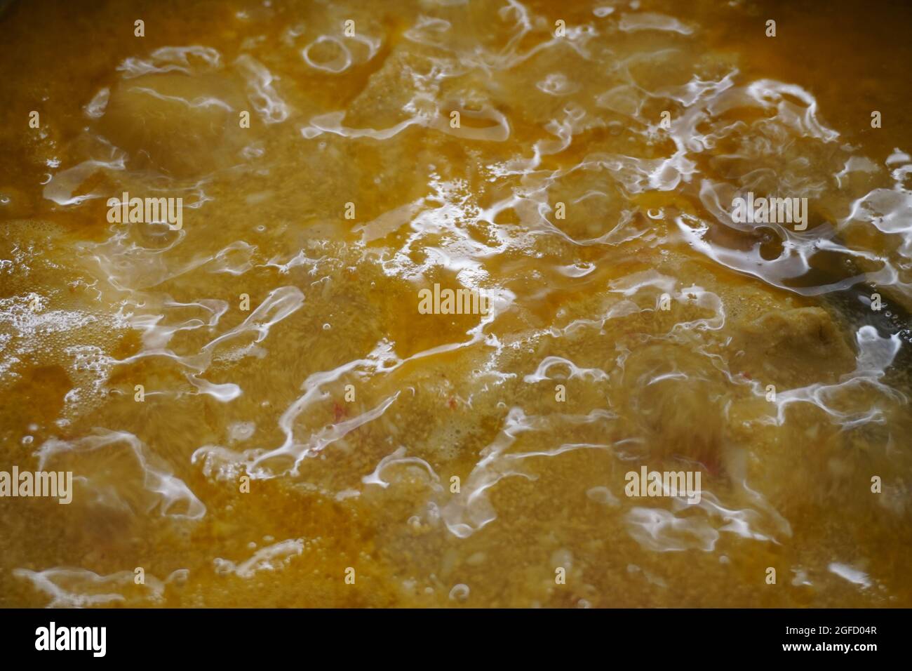 Closeup of unknown simmering stock Stock Photo