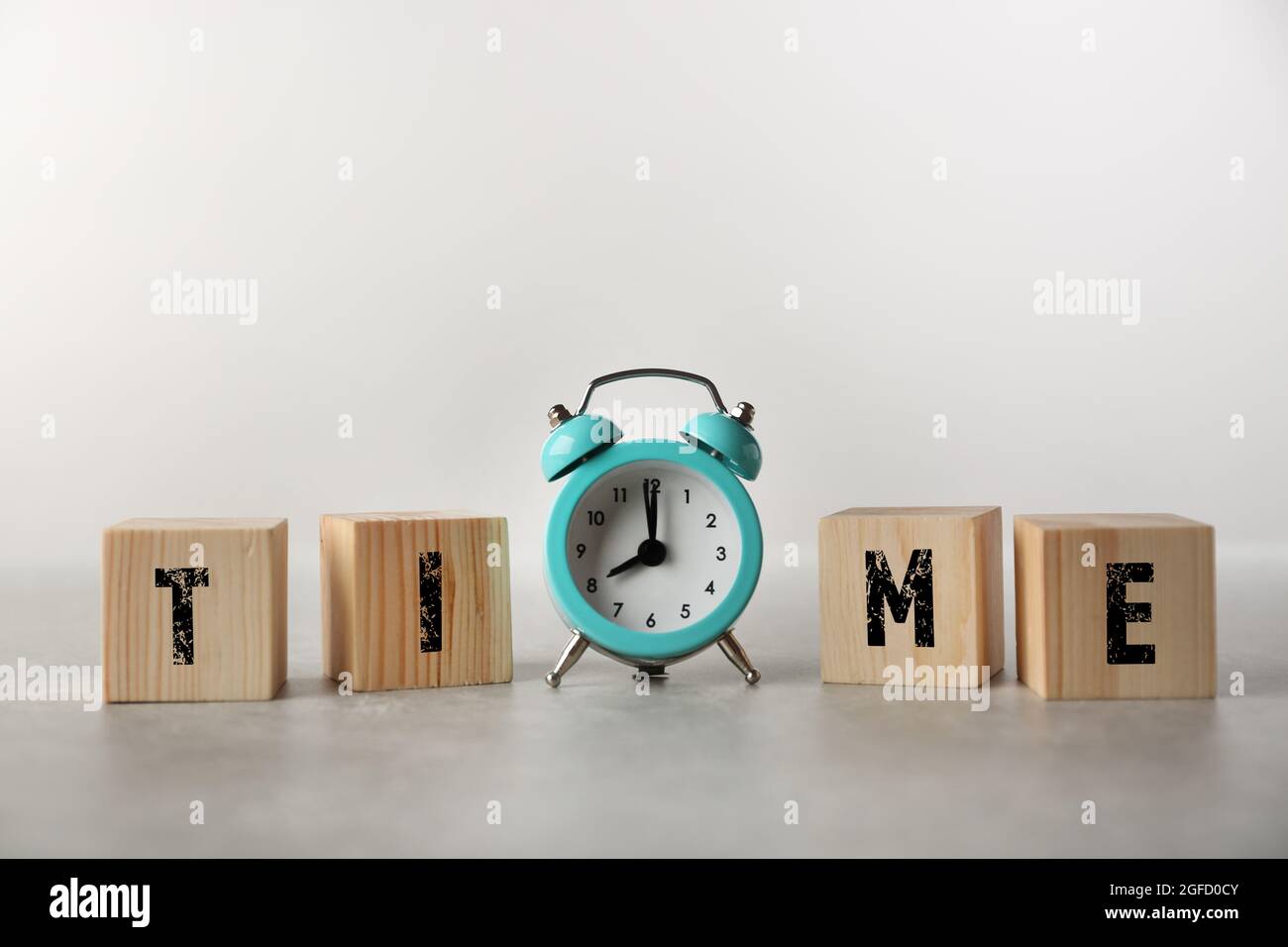 Clock and word TIME on grey background Stock Photo Alamy