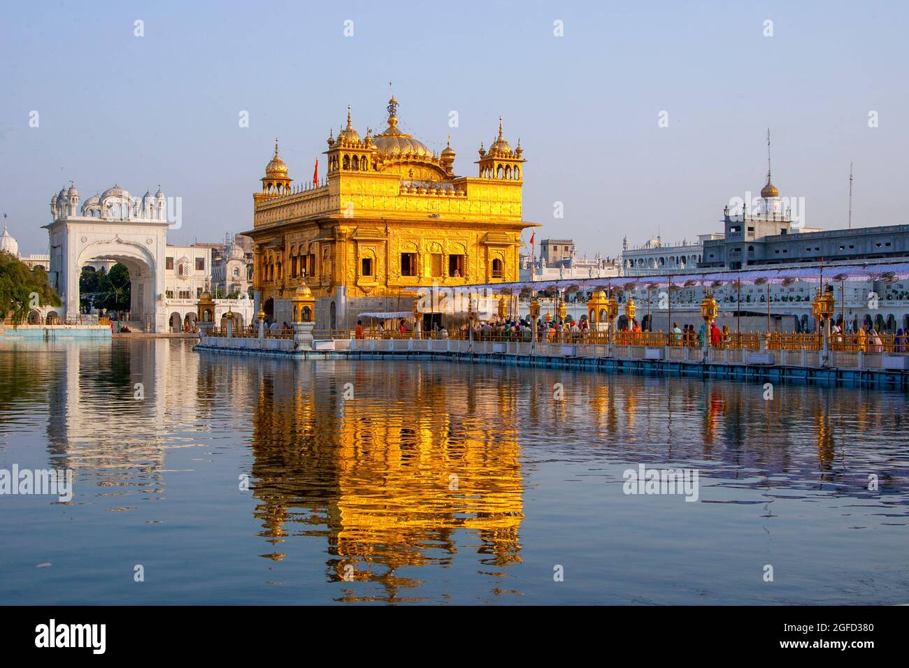 The Golden Temple (also known as Harmandir Sahib, lit. 'abode of God' or Darbār Sahib, meaning 'exalted court') is a gurdwara (place of assembly and w Stock Photo