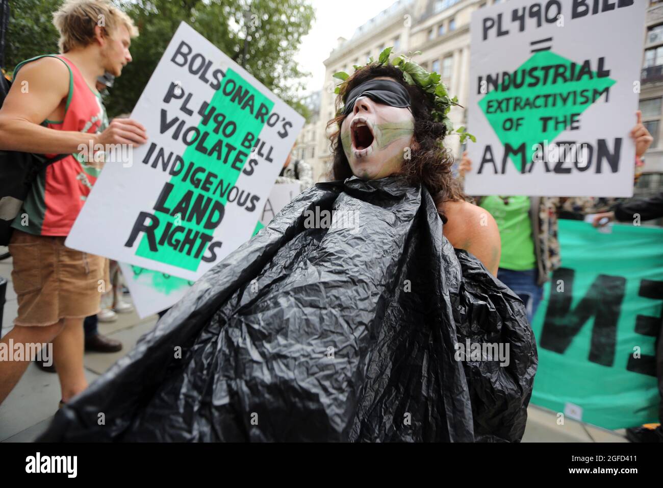 London, England, UK. 25th Aug, 2021. Climate change campaign group Extinction Rebellion activists stage a protest outside the Embassy of Brazil in London demanding protection of Amazon forests and indigenous lands in the third day of two weeks of planned action. (Credit Image: © Tayfun Salci/ZUMA Press Wire) Stock Photo
