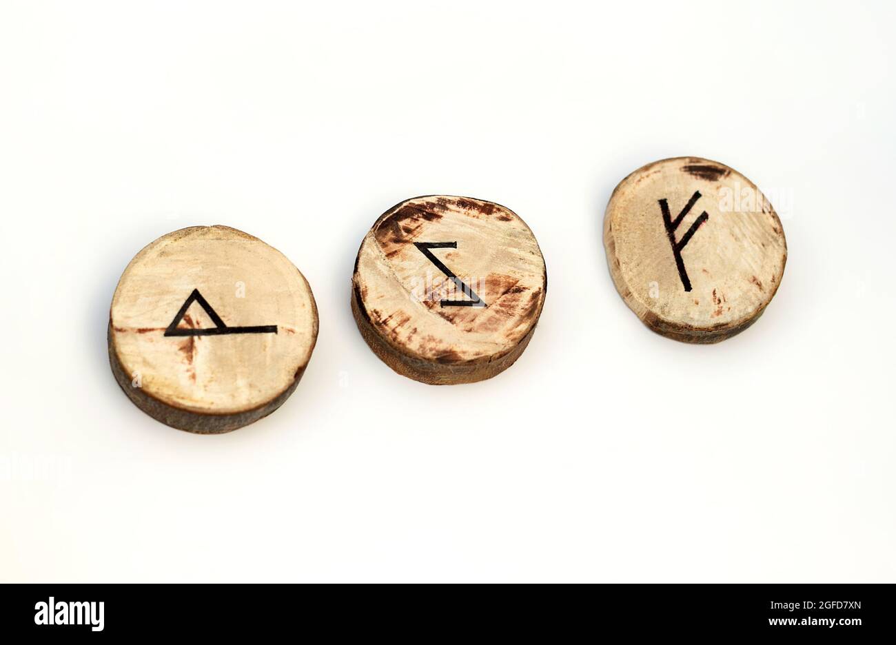 Village homemade round runes on a white background Stock Photo - Alamy