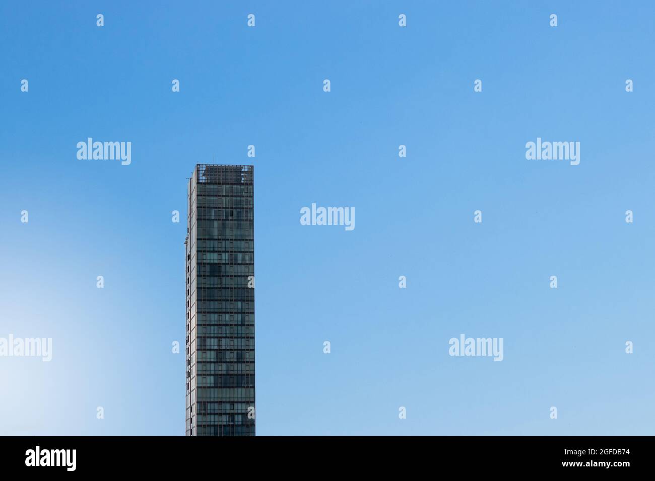 transparent glass wall of office building with blue sky Stock Photo - Alamy