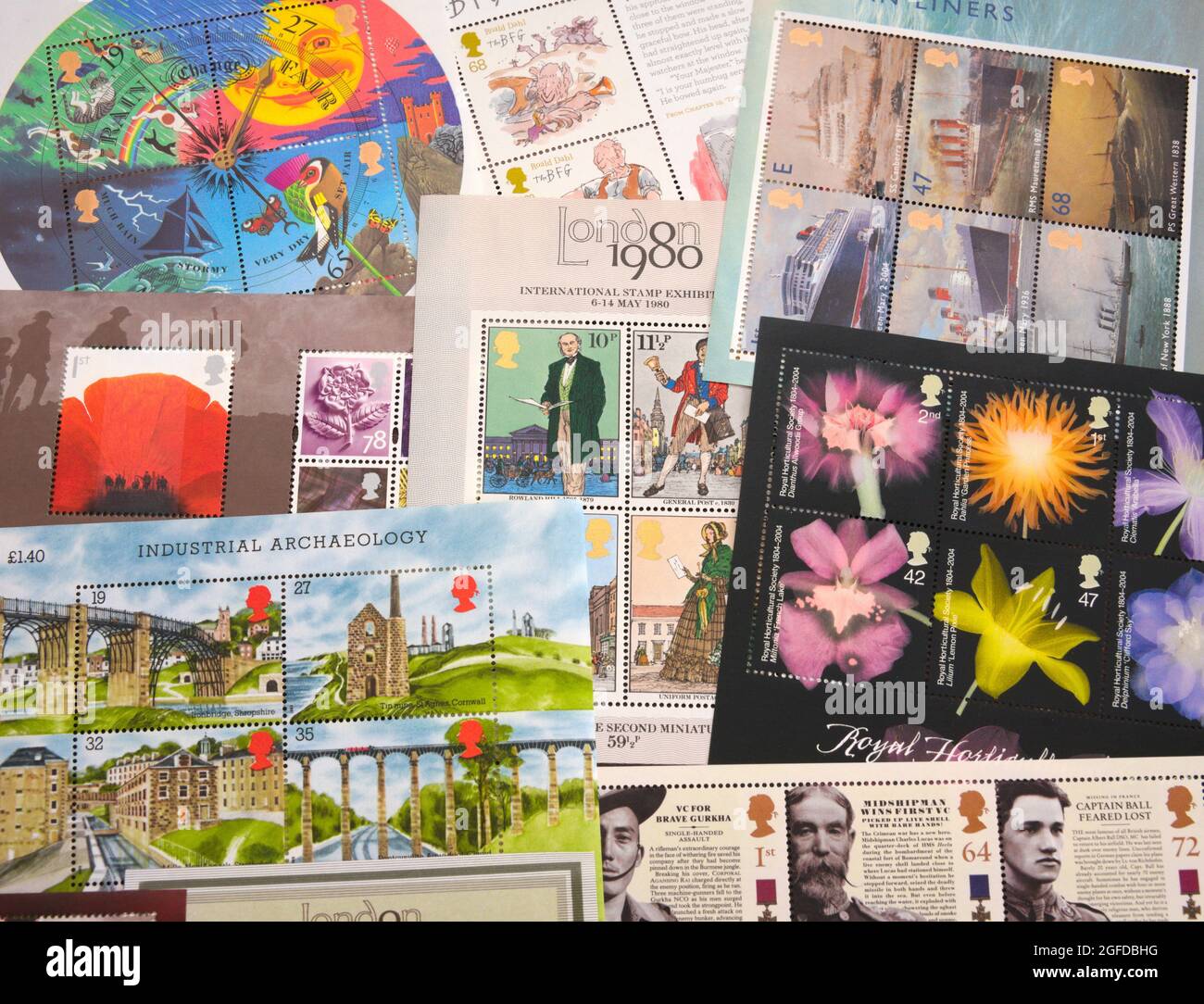 A group or collection of Royal Mail mini sheets of commemorative postage stamps, used to send or post items through the mail. Stock Photo