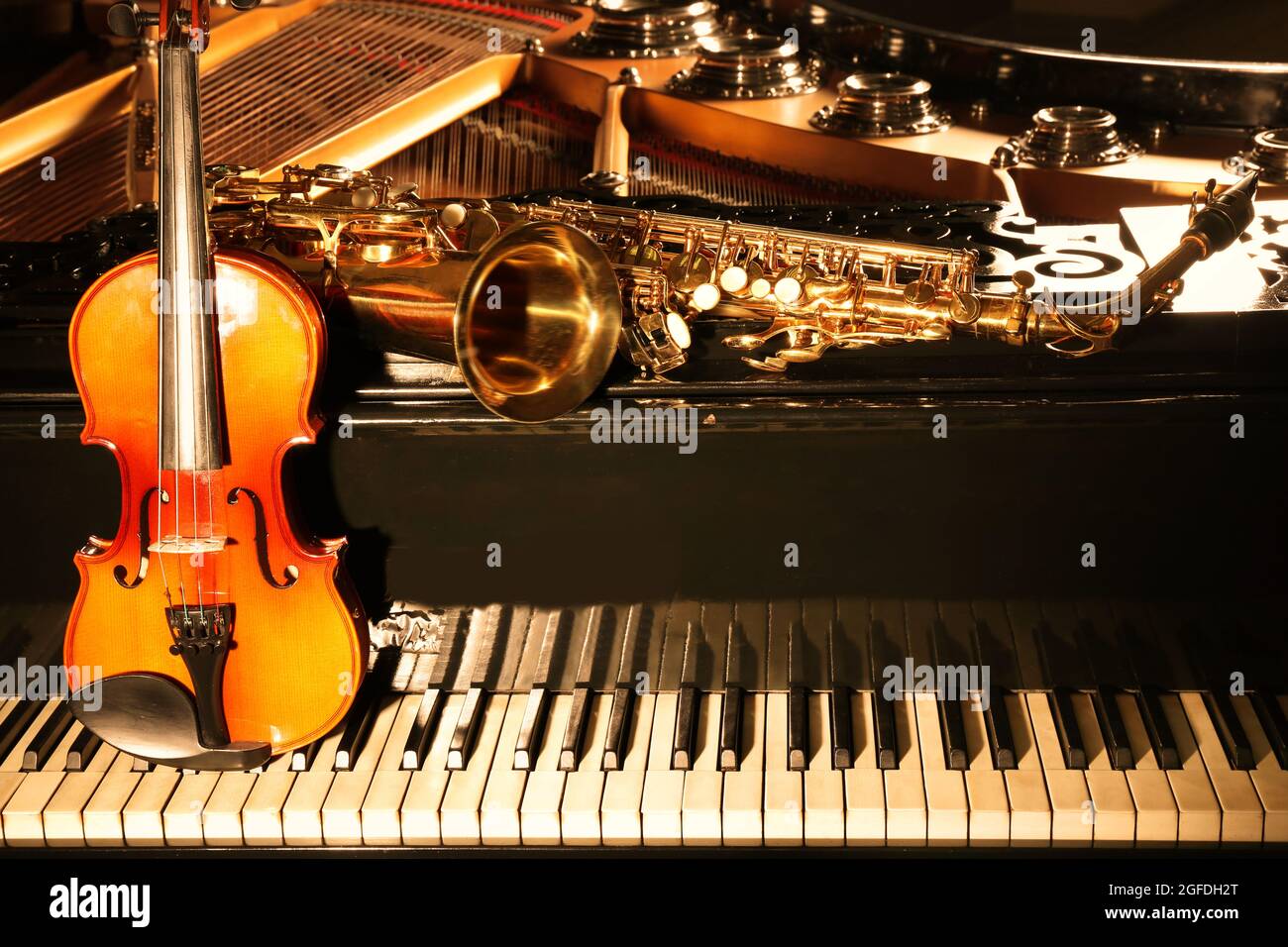 Violin with saxophone and piano, closeup Stock Photo - Alamy