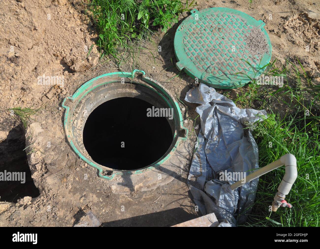 A closeup of a borehole pump house, station and water supply system