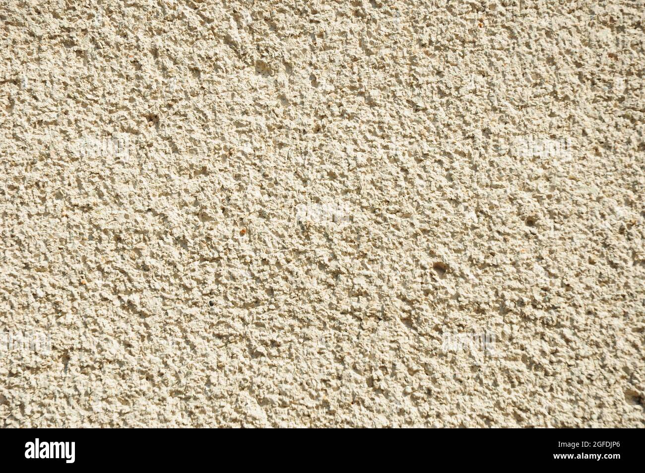 A closeup of a traditional stucco float sand finishing, heavy, fine