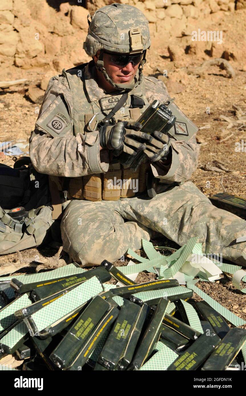 U.S. Army Sgt. Steve Maher, 707th Explosive Ordnance Disposal technician,  out of Fort Lewis, Wash., builds C-4 explosive charges being used to  destroy the "Taliban Hotel," a safehouse utilized by insurgent fighters