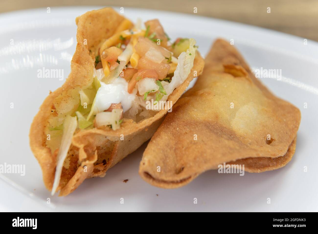 Hearty side order of crispy fried potato taco loaded with meat and