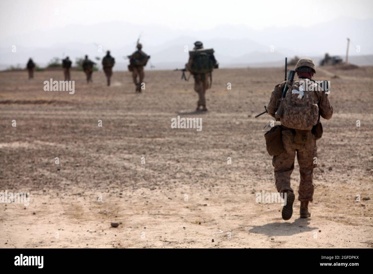 U.S. Marines with Fox Company, 2nd Battalion, 5th Marine Regiment, Regimental Combat Team 6 patrol to an objective during Operation Branding Iron II in the Ghaysarkah region, Helmand province, Afghanistan June 21, 2012. Marines conducted the operation to disrupt enemy logistics and deny the enemy freedom of movement. (U.S. Marine Corps photo by Lance Cpl. Ismael E. Ortega/ Released) Stock Photo