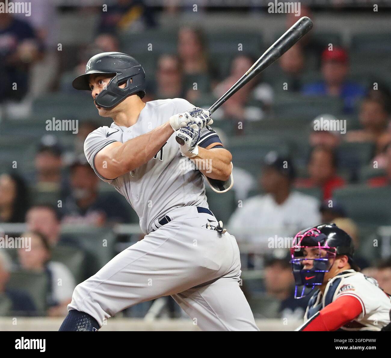 MIAMI, FL - AUGUST 22: New York Yankees left fielder Giancarlo Stanton (27)  runs out to right field during the fourth inning in a game between the  Miami Marlins and the New