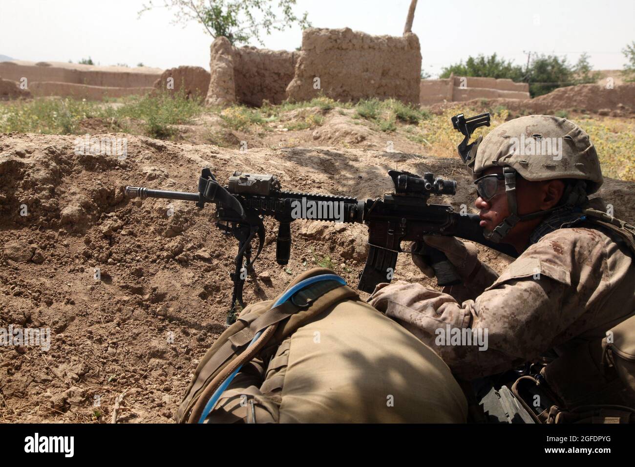 U.S. Marine Corps Lance Cpl. Christopher Ek with Fox Company, 2nd Battalion, 5th Marine Regiment, Regimental Combat Team 6 provides security while patrolling to an objective during Operation Branding Iron II in the Ghaysarkah region, Helmand province, Afghanistan June 21, 2012. Marines conducted the operation to disrupt enemy logistics and deny the enemy freedom of movement. (U.S. Marine Corps photo by Lance Cpl. Ismael E. Ortega/ Released) Stock Photo