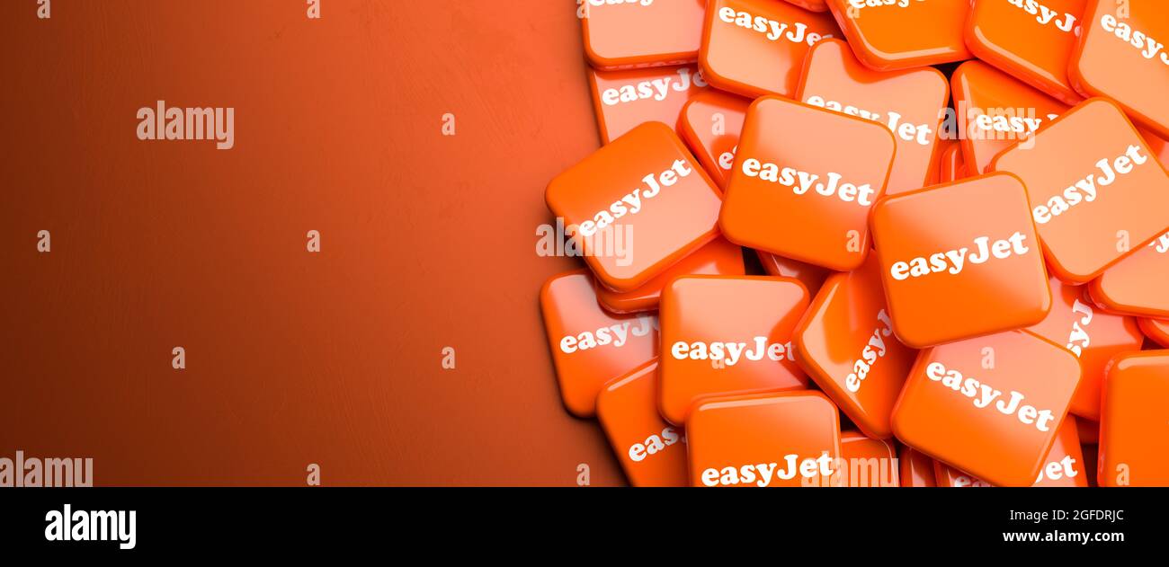 Logos of the British low-cost airline easyJet on an heap. Copy space. Web banner format. Stock Photo