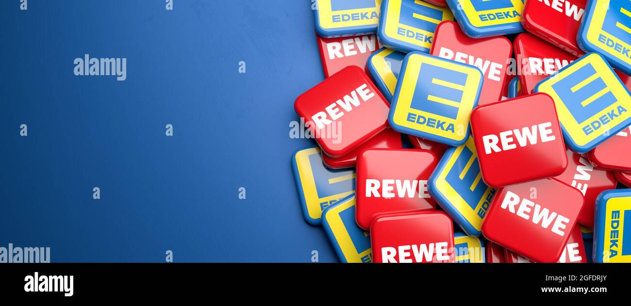 Logos of the competing German supermarket chains REWE and Edeka. Both are co-operative trade groups consisting of independent retailers. Copy space. W Stock Photo