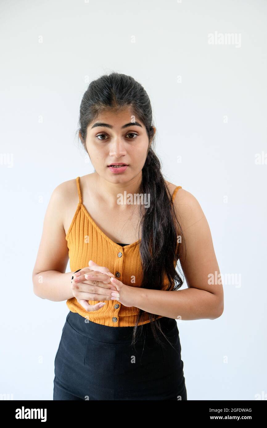 Vertical closeup of a girl looking at something. Stock Photo