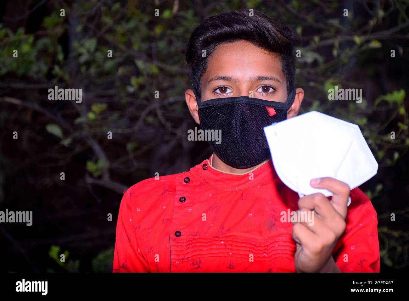 13 years old Asian cute boy wearing protective mask, prevention of