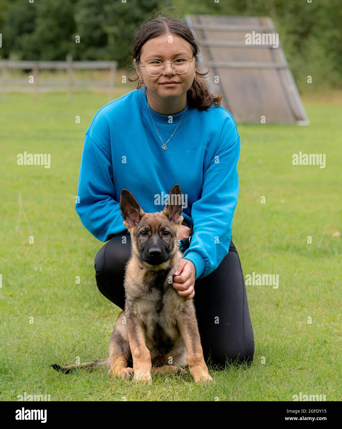 Teen girl walking dog hi-res stock photography and images - Alamy
