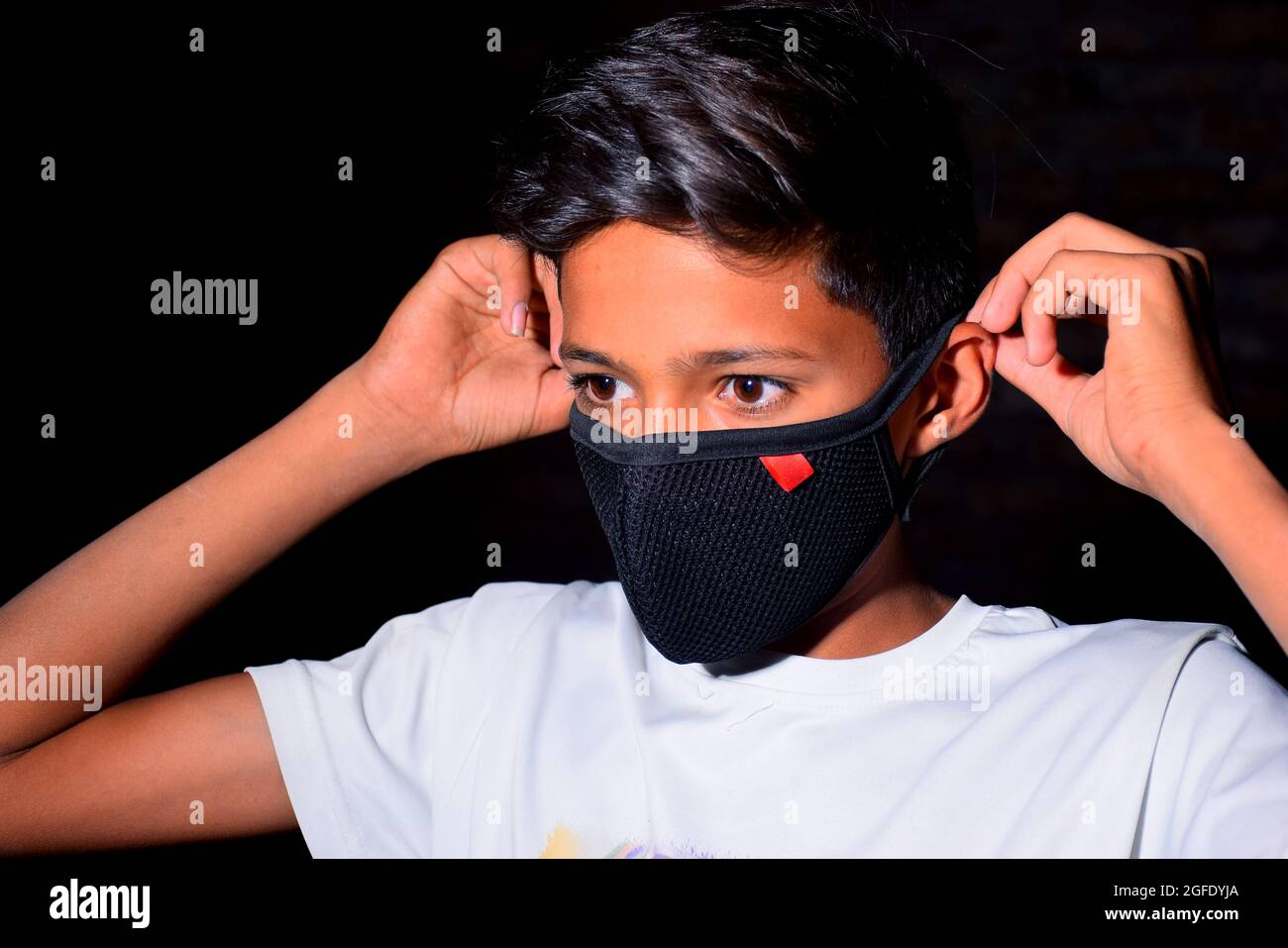 13 years old Asian cute boy wearing protective mask, prevention of