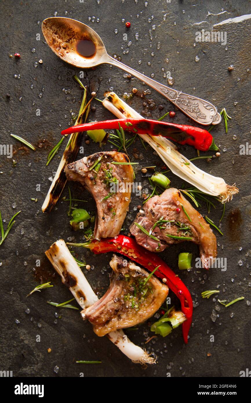Lamb chops cooked on the grill with leek and red pepper Stock Photo Alamy