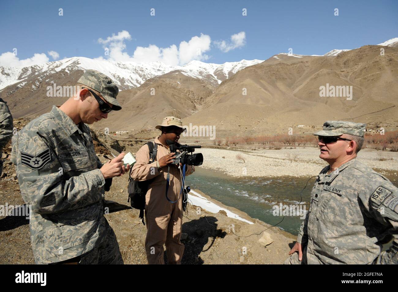 U.S. Air Force Staff Sgt. Zachary Wilson,  journalist and Staff Sgt. Chalanda Roberts, videogrpher, both from the AFCENT Combat Camera Team, interview U.S. Army Lt. Col. Steve Lancaster, Panjshir Provincial Reconstruction Team deputy commander on Mar. 5, 2009 in support of Operation Enduring Freedom.(U.S. Air Force photo by Staff Sgt. James L. Harper Jr.)Released Stock Photo