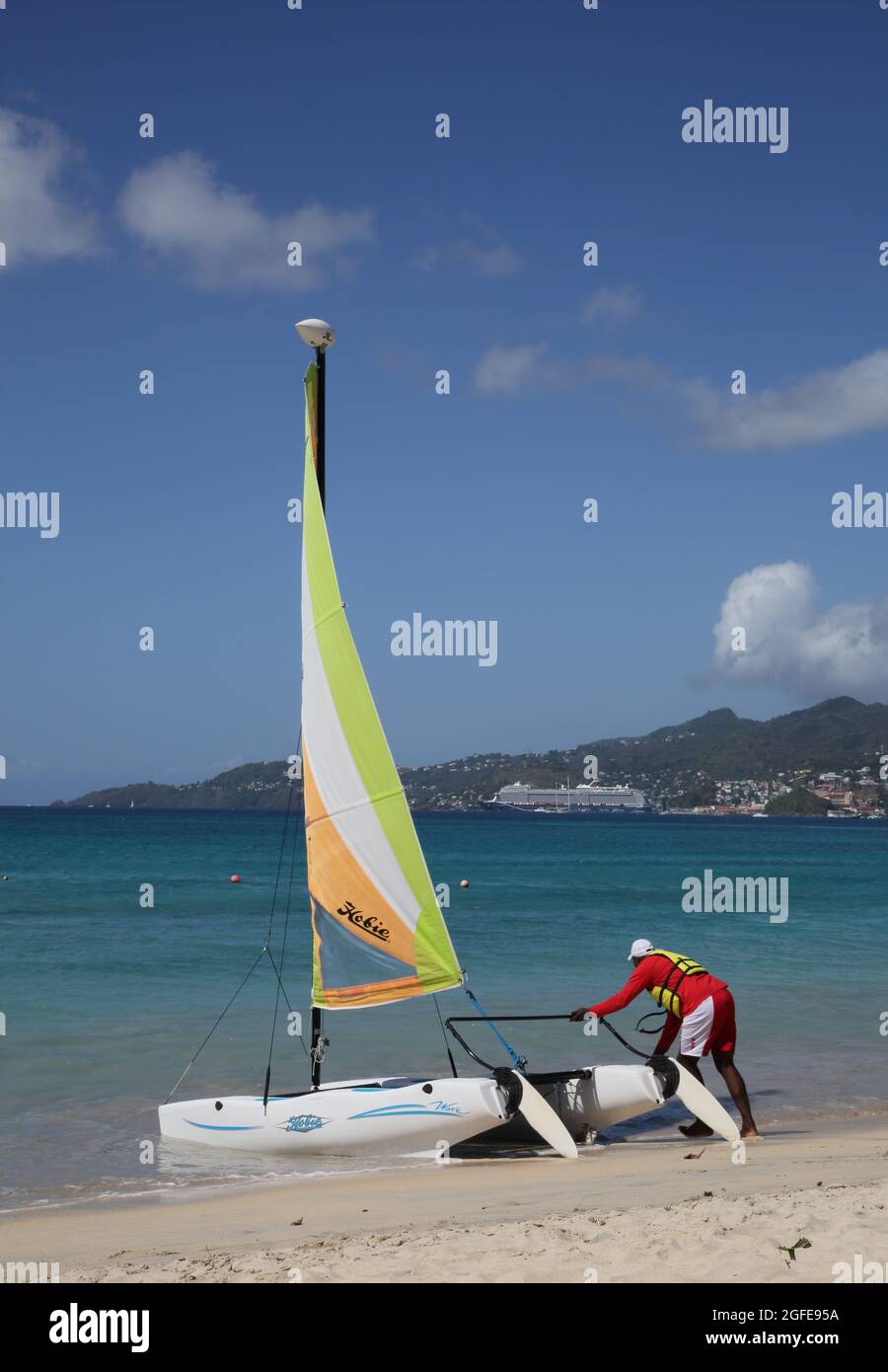 Grand Anse Beach Grenada Man Launching Catamaran Stock Photo
