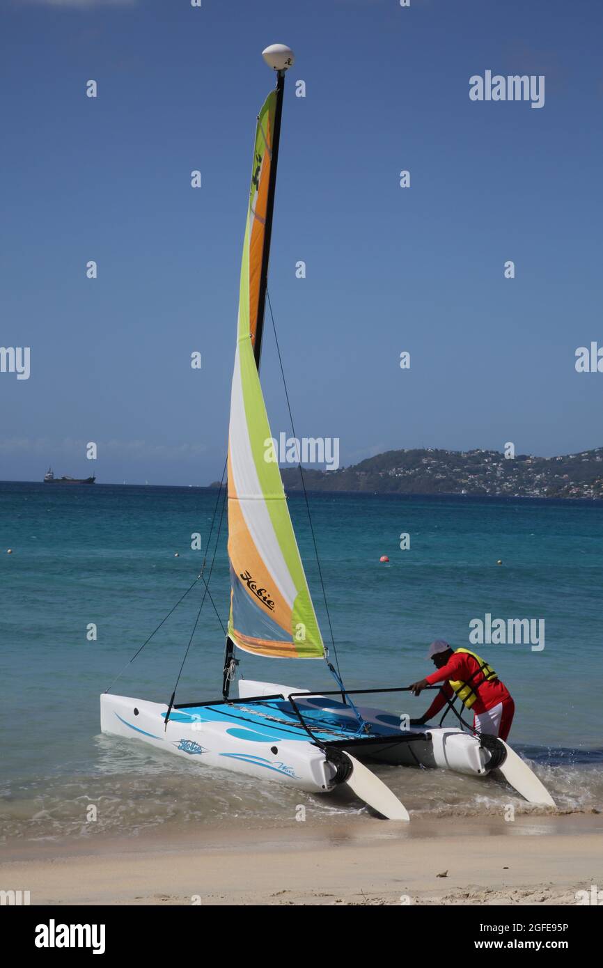 Grand Anse Beach Grenada Man Launching Catamaran Stock Photo
