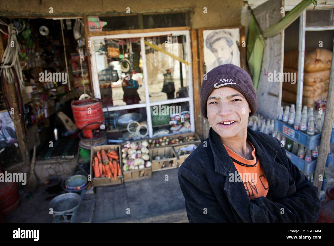 An Afghan kid stands outside a convenient store at the bazaar in the Rokha  District of Panjshir province, Afghanistan, Jan. 11 Stock Photo - Alamy
