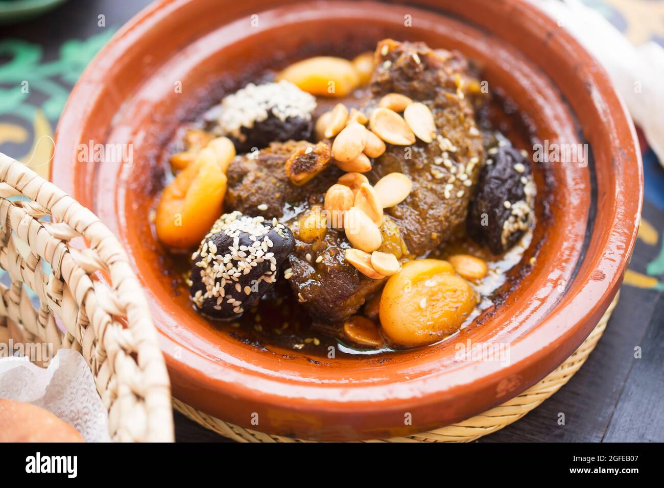 Moroccan lamb tajine with prunes, apricots, almonds and sesame seeds