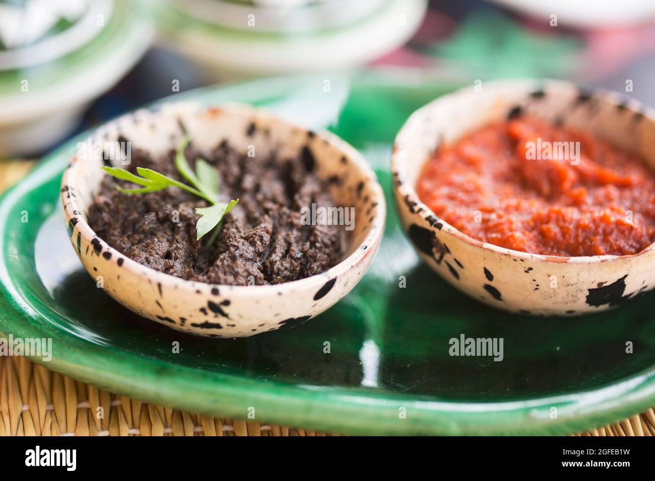 Harissa tomato paste and black olives paste. Appetiser, Morocco Stock Photo