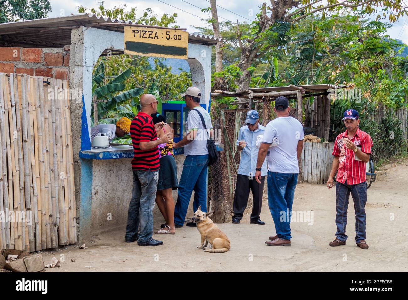 EL COBRE,  CUBA - FEB 1, 2016: Stall selling a street food pizza in El Cobre Stock Photo