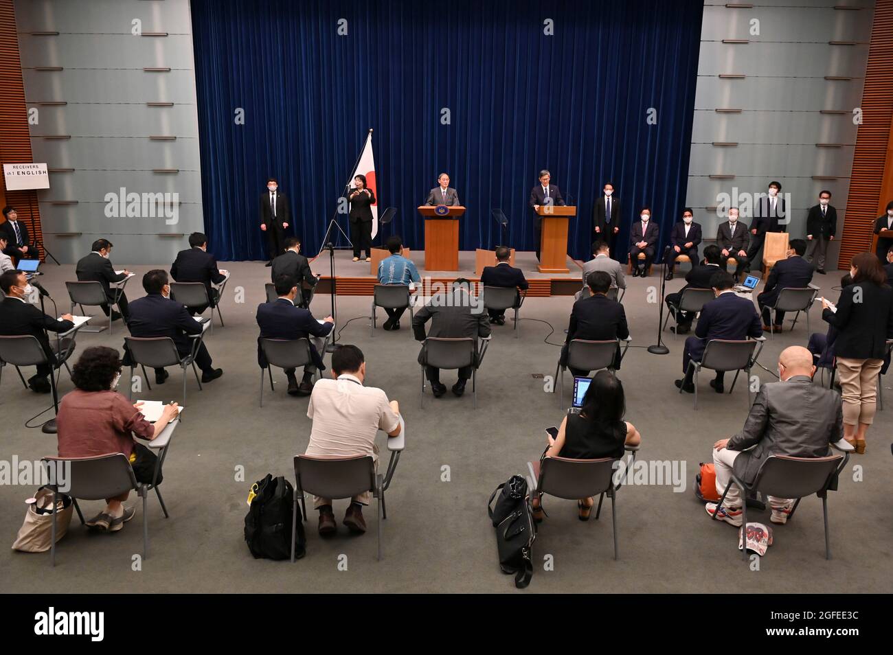 Tokyo, Japan. 25th Aug, 2021. Japan's Prime Minister Yoshihide Suga (top, C) attends a news conference at the prime minister's official residence in Tokyo. (Credit Image: © POOL via ZUMA Press Wire) Stock Photo