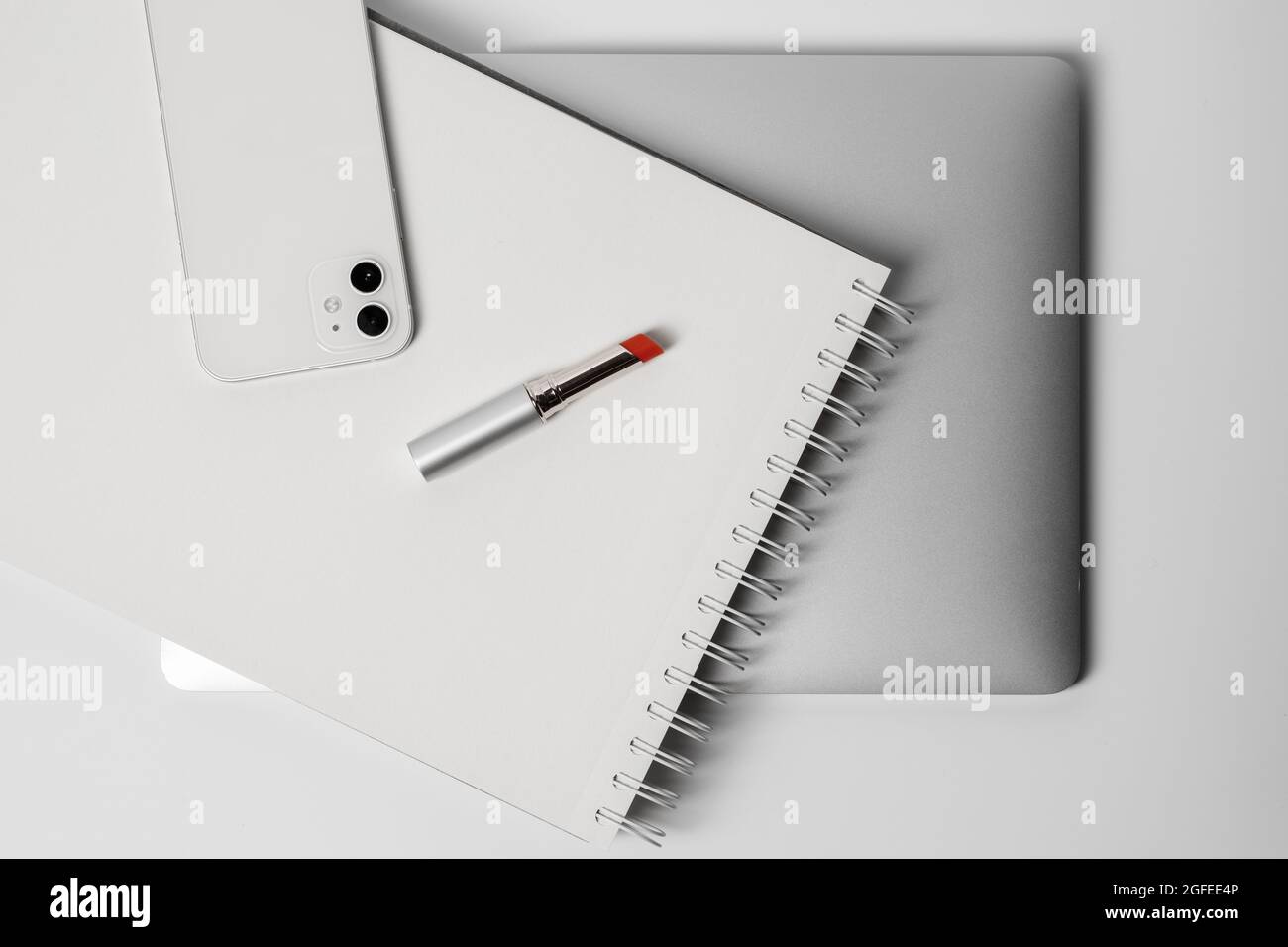 Telephone Notebook Red Minimalist and clean Female workspace with laptop, smart phone ...