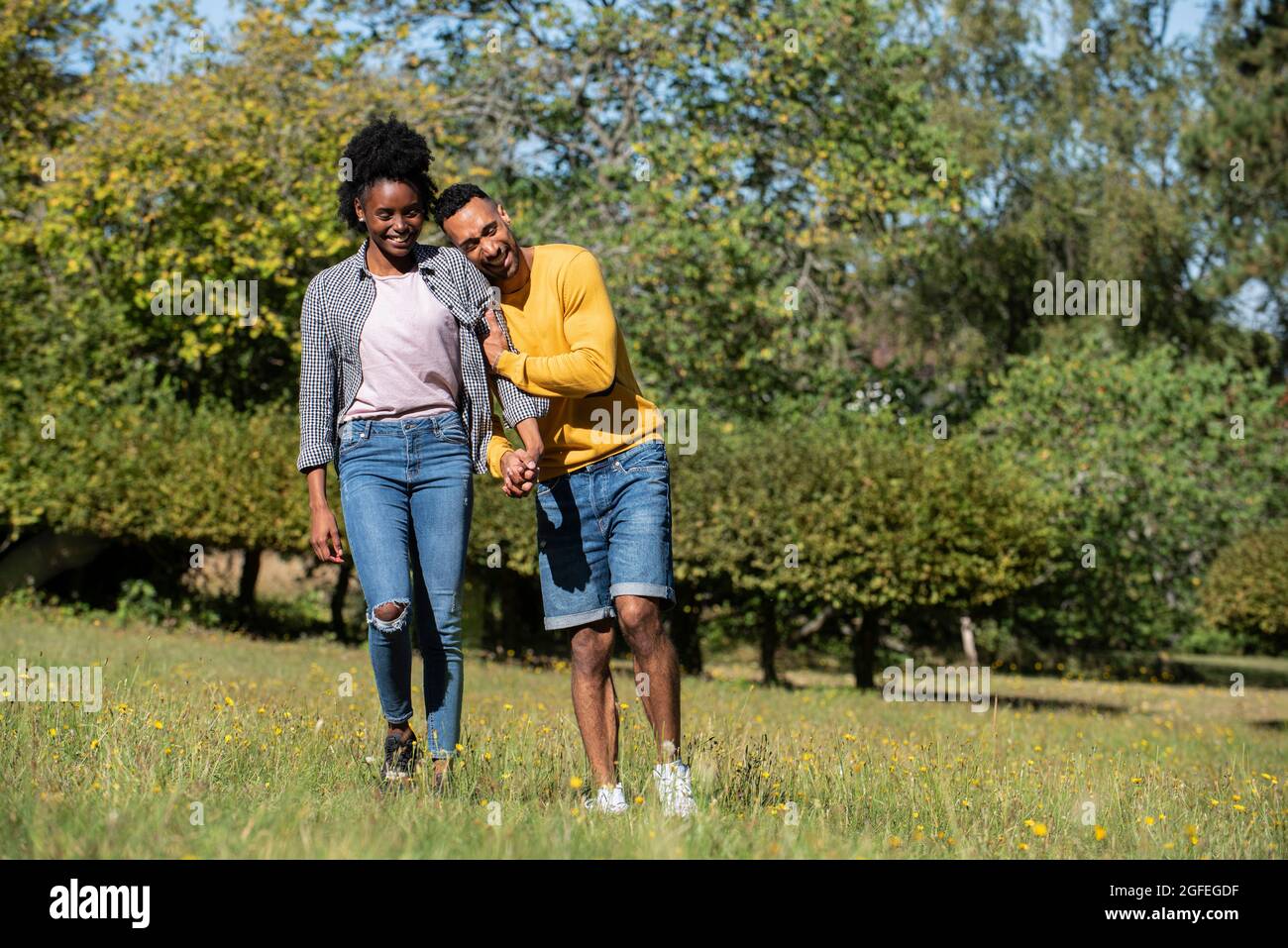 Young couples walking in park hi-res stock photography and images - Alamy