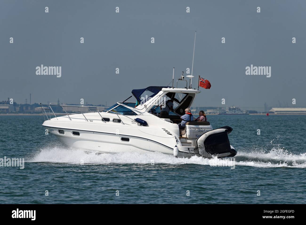 Nice Sealine S34 Sports Motor Yacht cruising along in The Solent near Cowes on the Isle of Wight Stock Photo