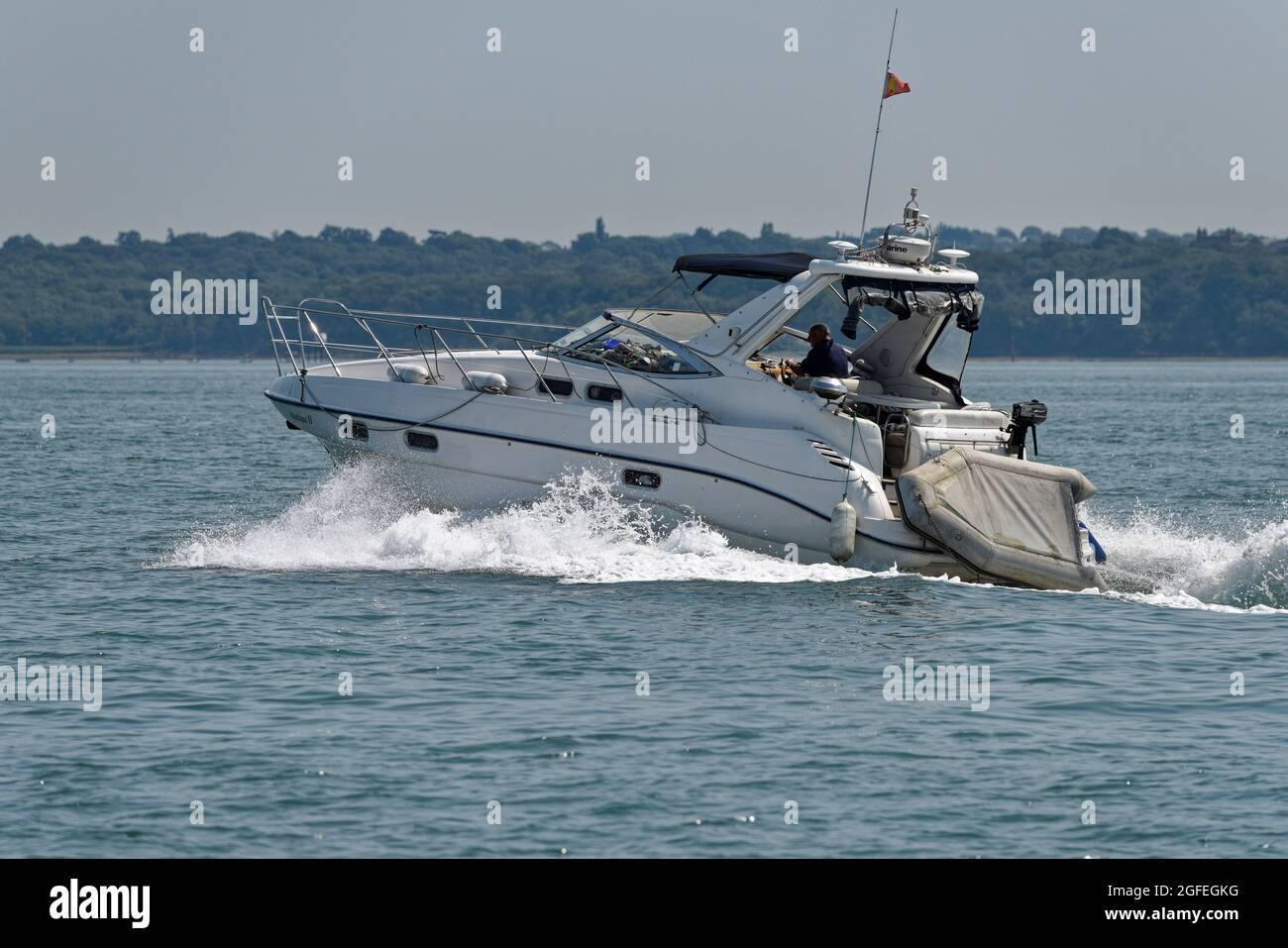 Sealine S34 Sports Motor Yacht cruising along in The Solent near Cowes on the Isle of Wight Stock Photo
