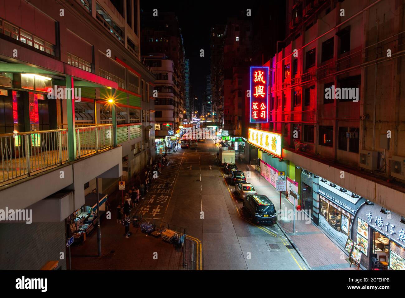 View of traffic moving on street at night, Hong Kong Stock Photo
