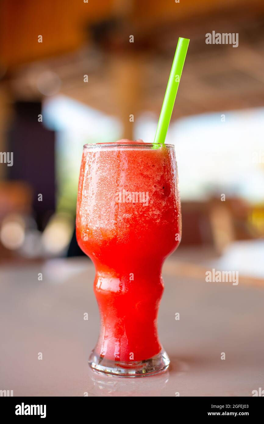 Watermelon smoothie in a misted glass with straws, soft drink on a summer day Stock Photo