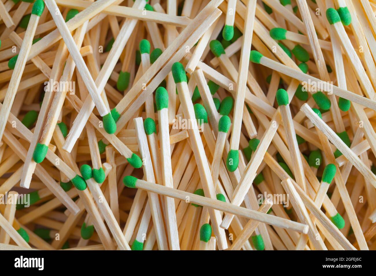 Large Pile of Green Matches Background Texture. Stock Photo