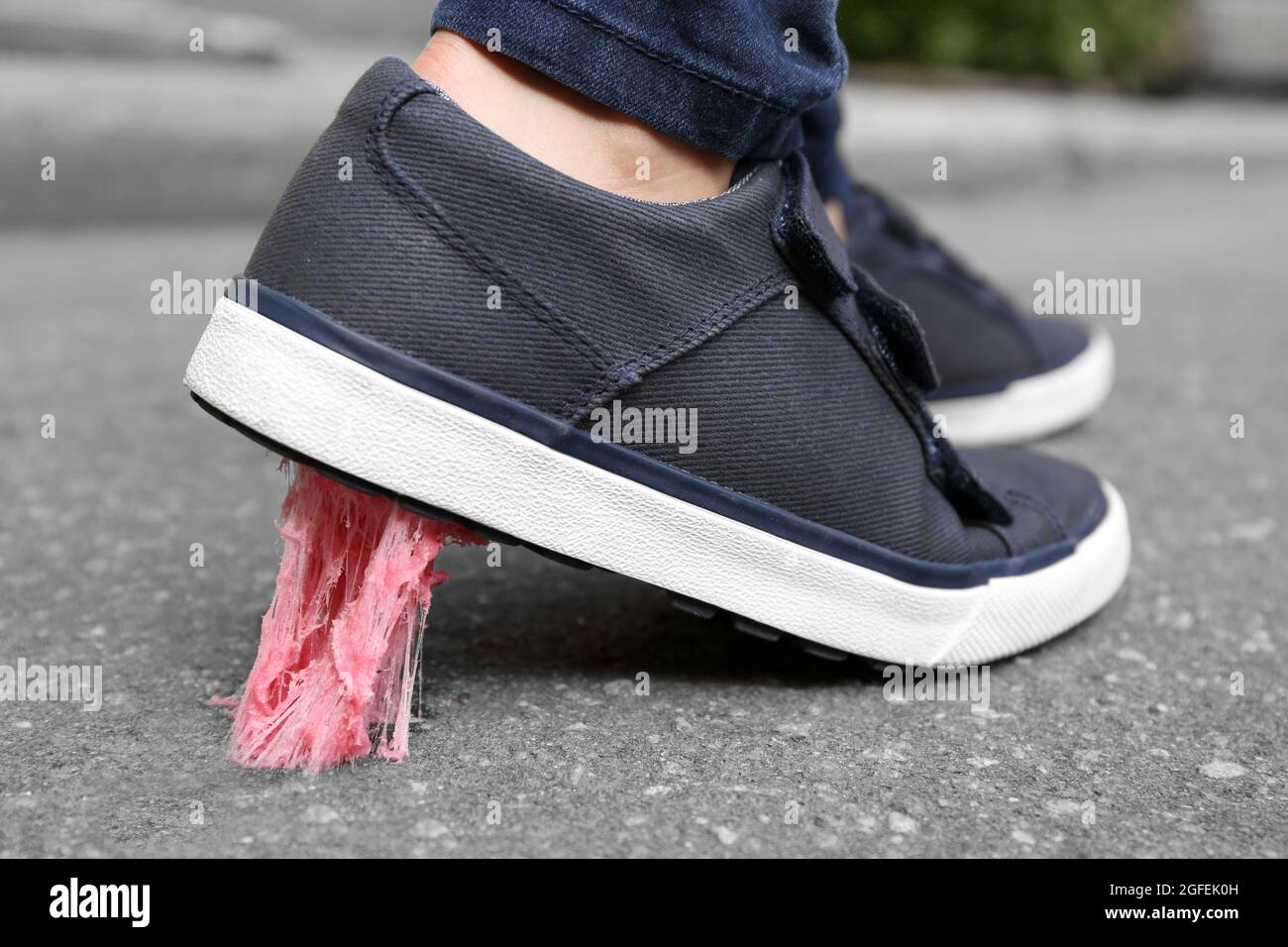 Foot stuck into chewing gum on street Stock Photo Alamy