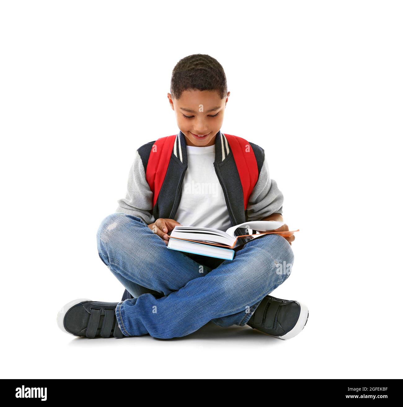 African American boy with books, isolated on white Stock Photo - Alamy