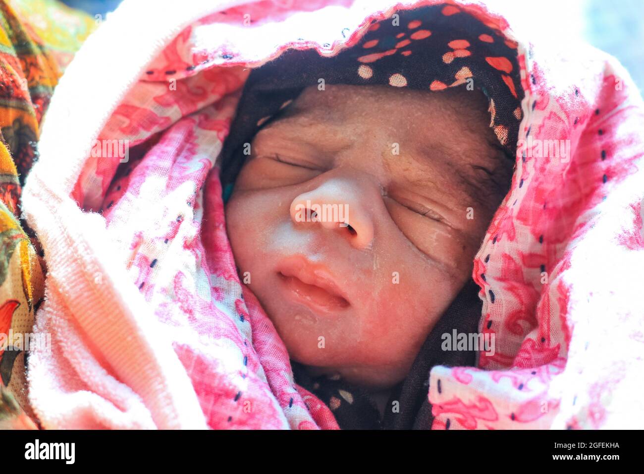 Beautiful baby boy a few seconds after the birth. Baby after birth