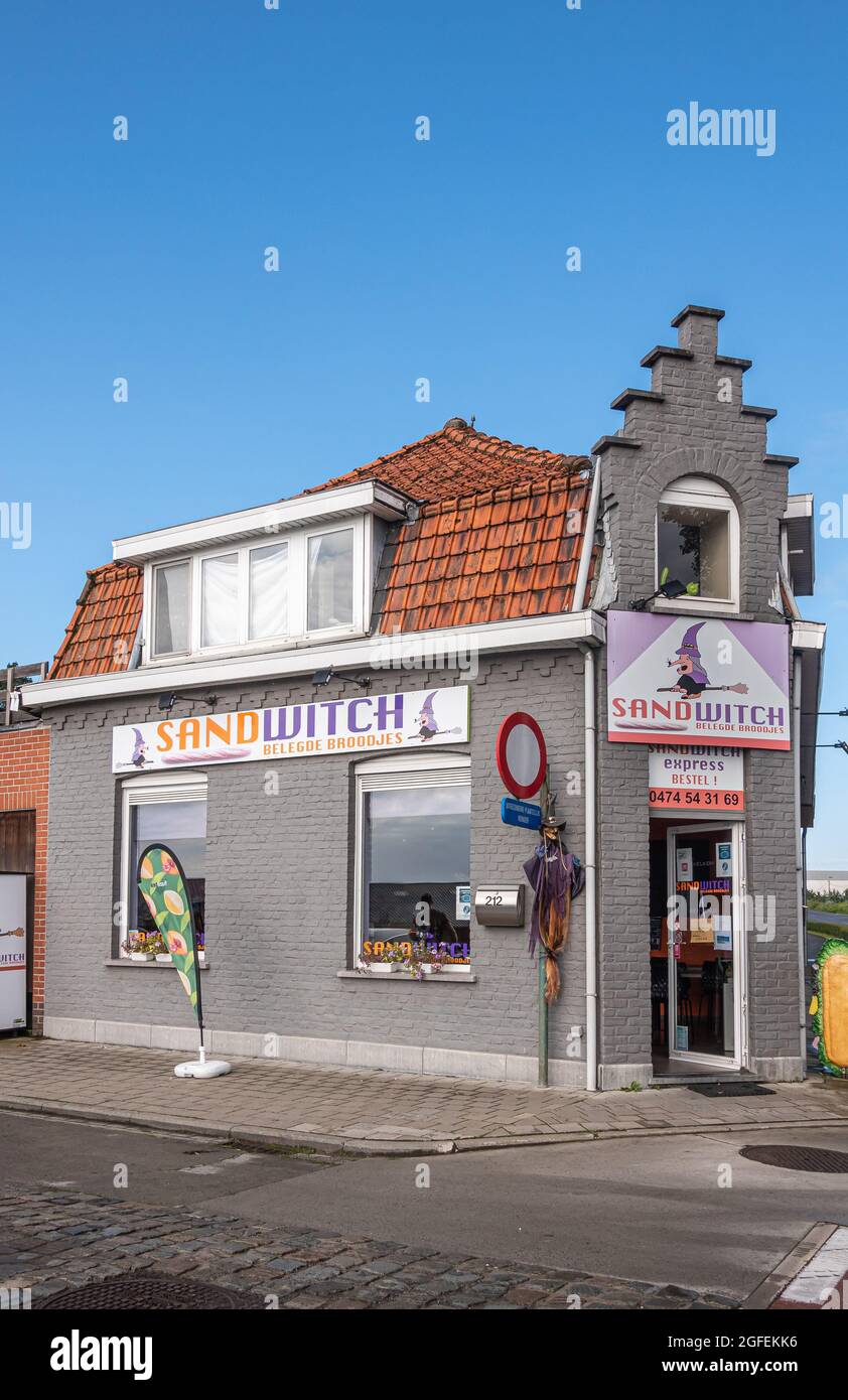 Zonnebeke, Belgium - August 2, 2021: Closeup of small Take-out restaurant Sandwitch traditional house at roundabout off A19 and on N303 roads under bl Stock Photo