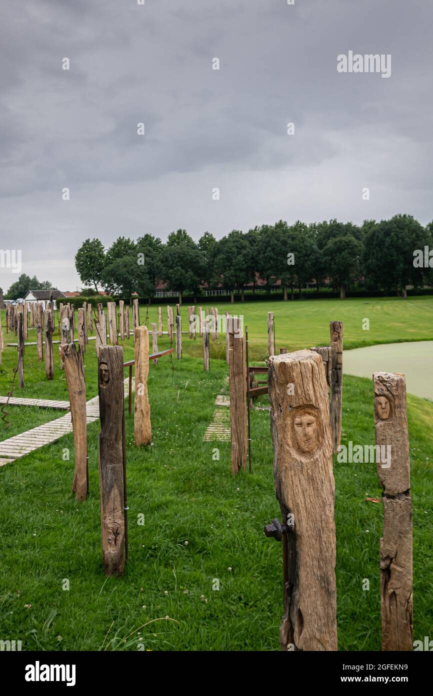 Diksmuide, Flanders, Belgium - August 3, 2021: Faces of War exhibition brings 129 wooden sleepers together, each with a face as symbol of fallen soldi Stock Photo
