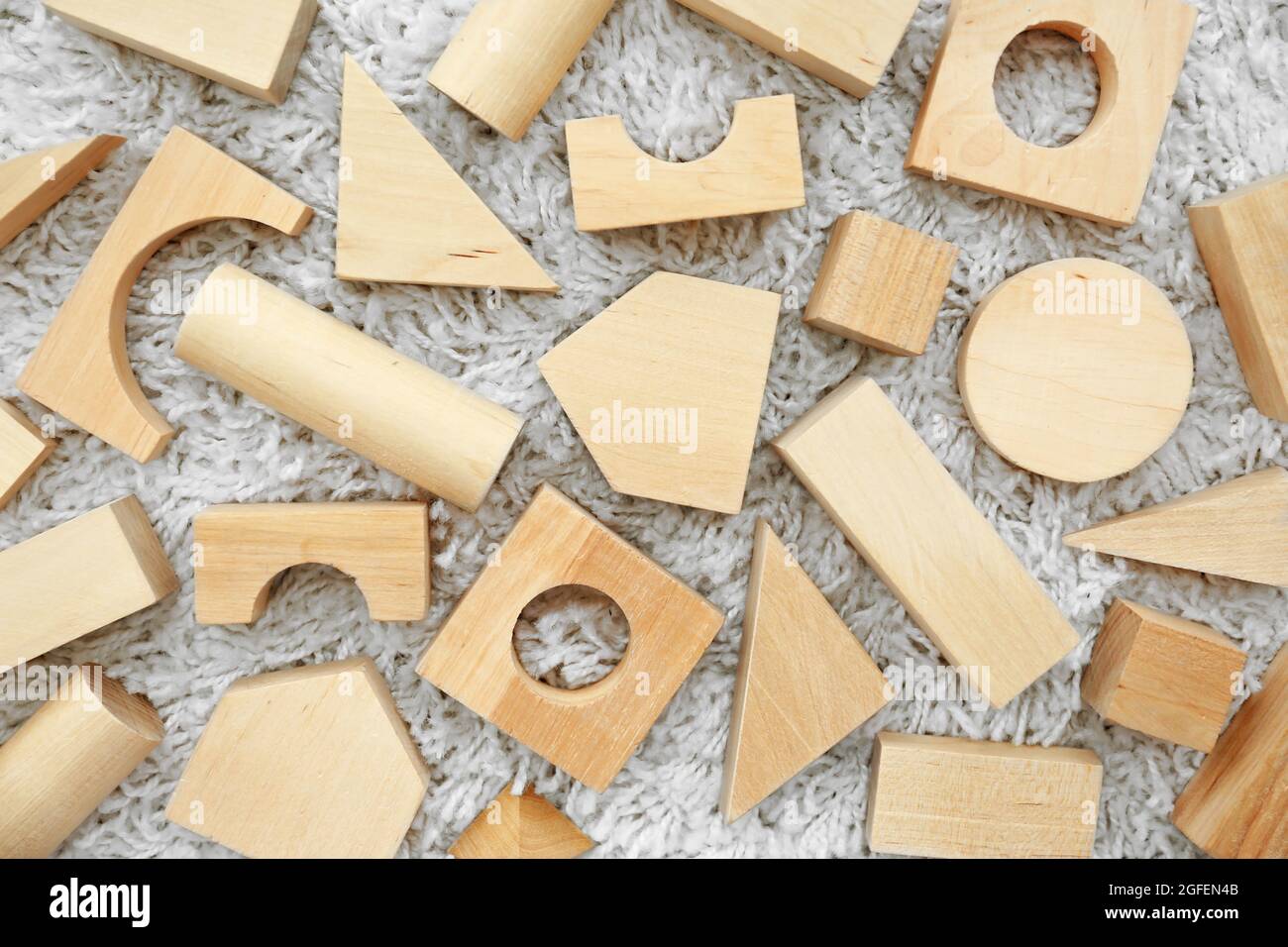 Wooden children's building blocks background Stock Photo - Alamy